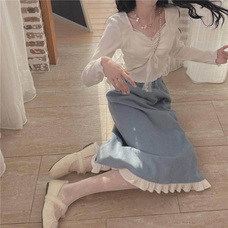 A Woman Wearing Sweater With Base Top